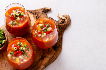 Spanish tomato gazpacho cold soup styled and decorated in glassesの写真素材