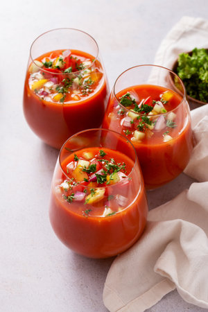 Spanish tomato gazpacho cold soup styled and decorated in glassesの写真素材