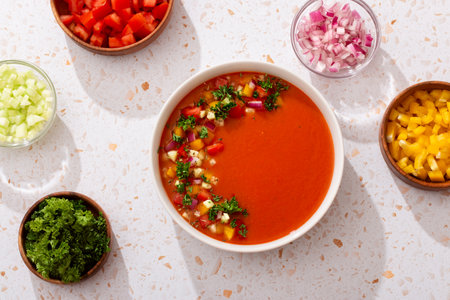 Spanish tomato gazpacho cold soup styled and decorated in white plateの写真素材