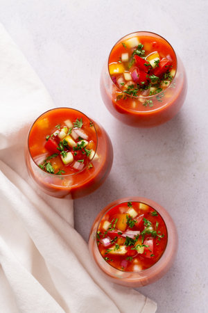 Spanish tomato gazpacho cold soup styled and decorated in glassesの写真素材