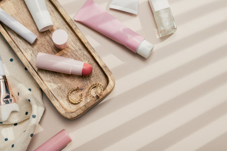 Beauty products frame background flat lay with skincare, haircare and makeup items on beige background filled with shadows,nostalgic retro aesthetic, top view, copy spaceの写真素材
