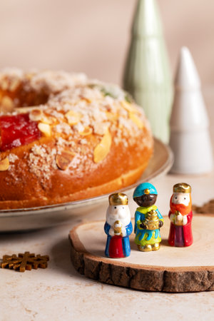 Card with traditional Three Kings Cake, three figurines of the kings in frontの写真素材