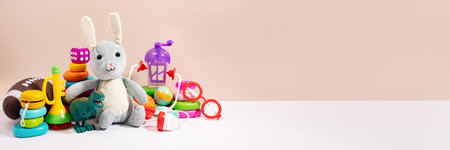 Toys for children ready for donation against a beige background, minimal style still life. Concept of toys donations, charity for children, copy spaceの写真素材