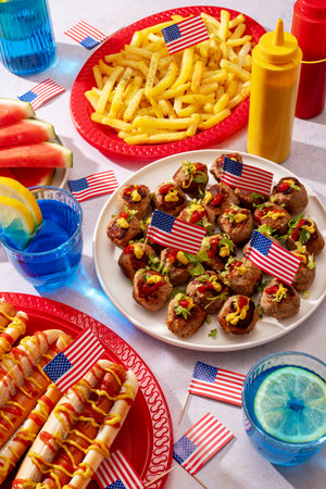 American food frame with hot dogs, fries, meatballs, decorated with USA flagsの写真素材