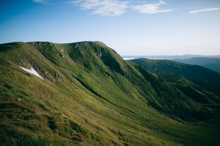 Sunshine in mountains. Snow.の写真素材
