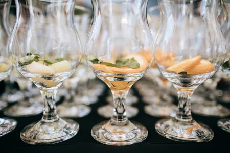 Many glasses for drinks on the wedding tableの写真素材