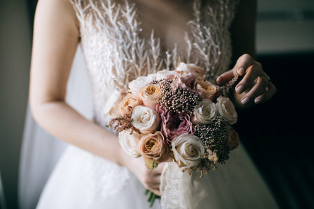 wedding bouquet in hands of bride