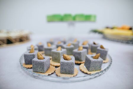 Original dessert cakes with almonds on the buffet tableの写真素材