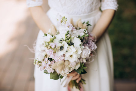 wedding bouquet in hands of bride