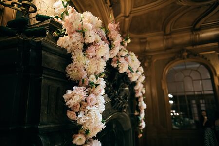 wedding decoration a fireplace fresh flowers at a wedding ceremonyの写真素材