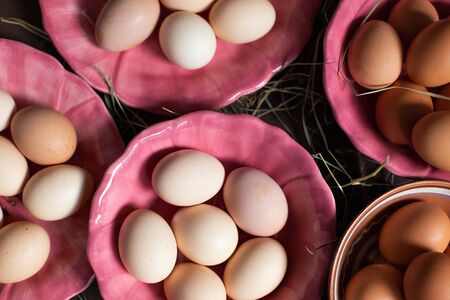Natural food. Fresh homemade eggs on platesの写真素材