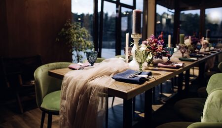 Catering service, table with chairs and flowers in restaurantの写真素材