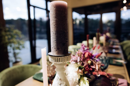 Table decoration with candles, wedding reception table in restaurant