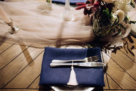 Wedding dinner table setting with silver knife and fork