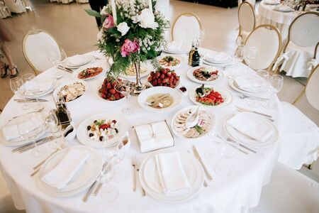 Restaurant table with food. Catering service. Wedding celebration, decoration. Dinner time, lunch.の写真素材