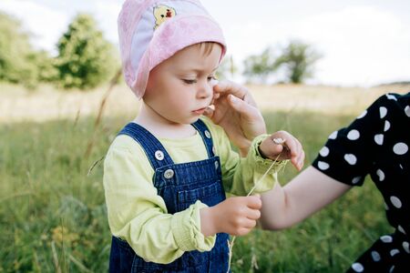 baby and mother Playing outdoors in the summer parkの写真素材