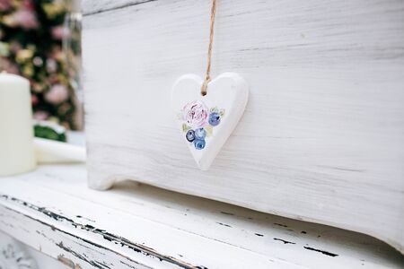 wedding hand made decoration, wooden heart with flowers	の写真素材