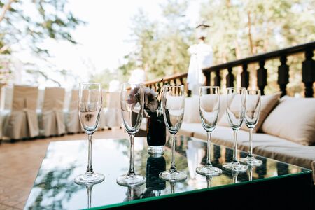 empty Champagne glasses closeup, Wedding reception alcohol drink tableの写真素材