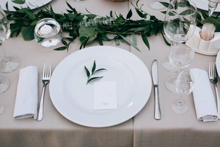 Elegant table setting for a festive wedding dinnerの写真素材