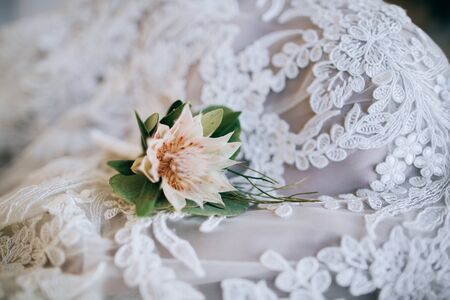 Boutonniere for the groom at the wedding dressの写真素材