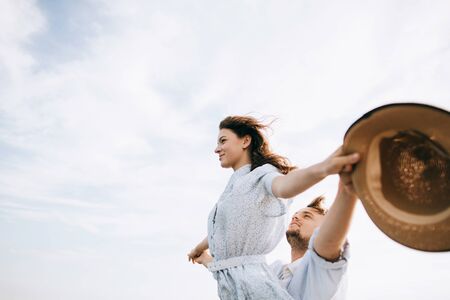 Young happy couple in love on summer vacation at seaの写真素材