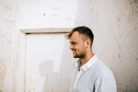 Portrait of a young handsome smiling man. Lifestyle portrait