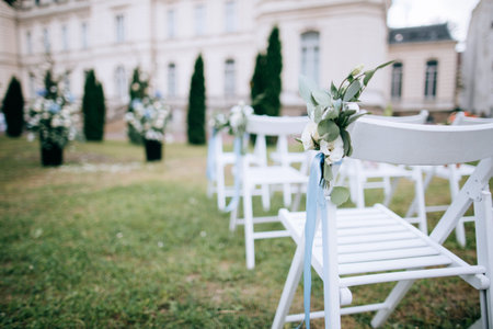 Decorated chairs at the wedding ceremony	の写真素材