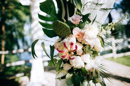 bouquet of beautiful white flowers on the wedding arch	の写真素材