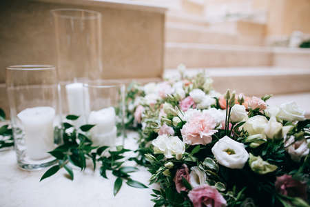 Rustic wedding decor, decorated stairs white candles and fresh flowersの写真素材