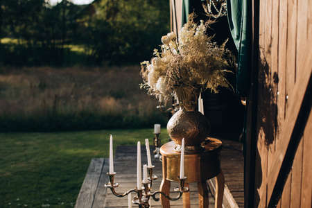 Beautiful rustic decor for a wedding ceremony in the summer garden in the villageの写真素材