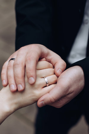 The groom puts a wedding ring on the bride's finger. wedding ceremony. The concept of loveの写真素材