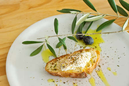 Appetizer with bread olive oil and cheeseの写真素材