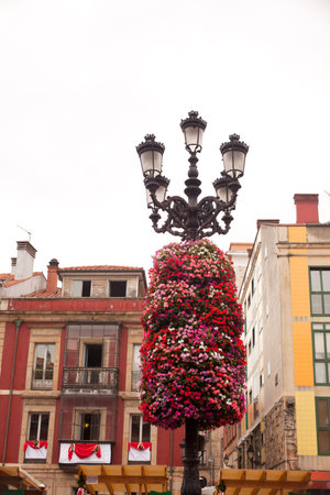 Flower decoration on a street light in Gijon, Asturiasの写真素材