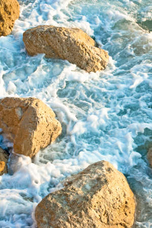 Stones in the rough seaの写真素材