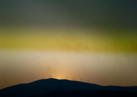 Windmills Turbines Propellers Energy on hillの写真素材