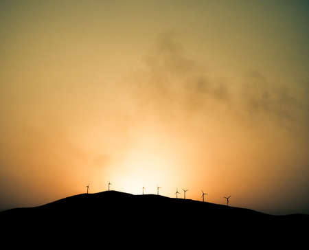 Windmills Turbines Propellers Energy on hillの写真素材