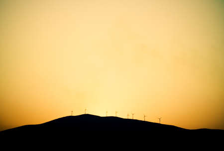 Windmills Turbines Propellers Energy on hillの写真素材