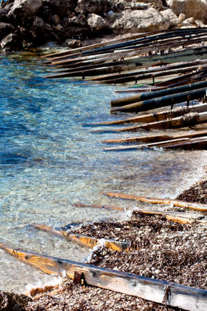 Wooden poles on the seaの写真素材