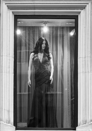 Female mannequin in a red dress in a shop windowのeditorial素材