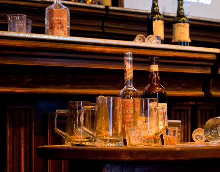 Photo of whiskey Bottles and glasses on deskのeditorial素材