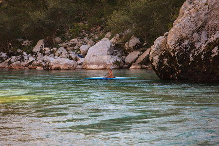 KOBARID, SLOVENIA - AUGUST 18: An sport kayaker rowing in the Soca river, August 18, 2012 in Kobarid, Sloveniaのeditorial素材