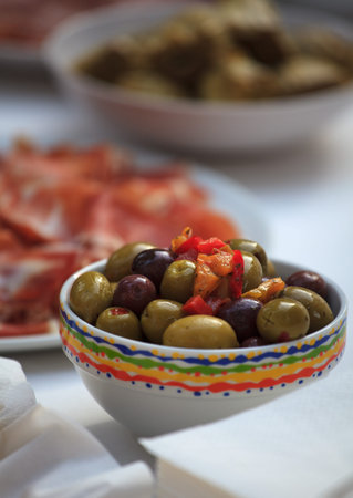 Fresh olives and other food in the cups