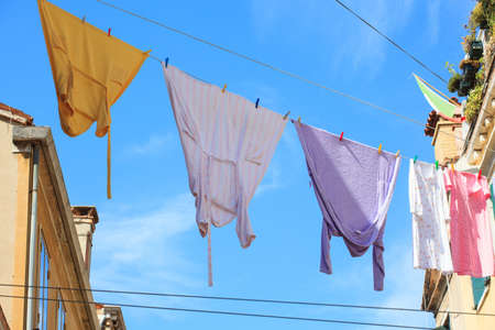 Clothes hanging to dry on a clothes-lineの写真素材