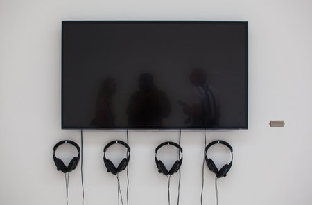 VENICE, ITALY - MAY 29: Monitor and headphones in the Serbian's National Pavilion in the Venice biennale 2013 on 29, May 2013のeditorial素材