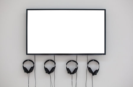 Monitor and headphones on the wall