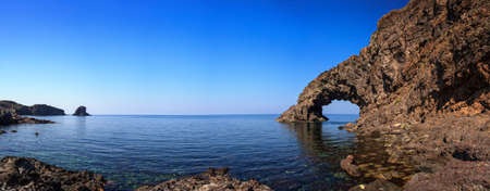 View of Arco dell'Elefante and Faraglioni in the Pantelleria island, Sicilyの写真素材