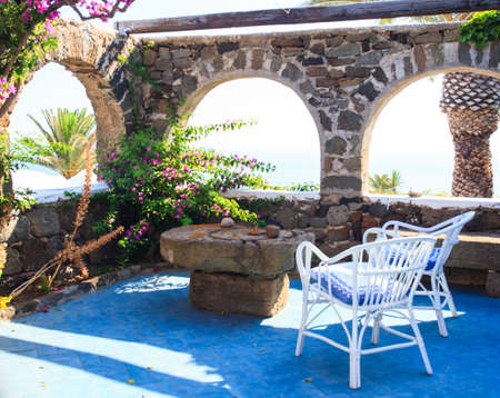 Chairs and stone table in a dammuso in Pantelleria, Sicilyの写真素材