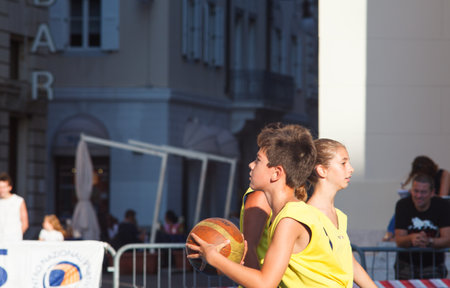 TRIESTE, ITALY - SEPTEMBER 09: Children playing basket in Trieste on September 09, 2013のeditorial素材