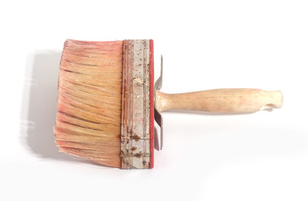 Close up of dirty paintbrush on white