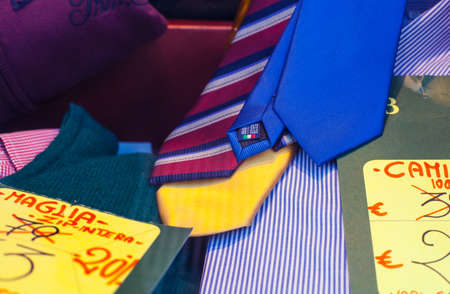 View of colorful neckties and shirts in the clothes shopの写真素材